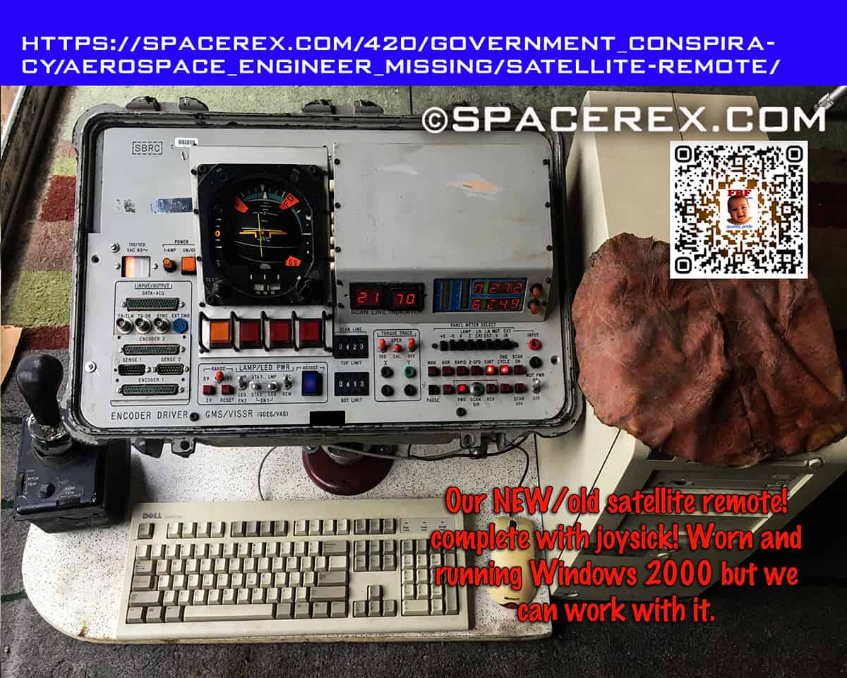 A space industry grade satellite controller from thirty years ago with a joystick and a 1990's Dell Desktop computer. The computer has a suspicious flap of red skin draped over it. THe caption reads "Our NEW/old satellite remote! complete with joysick! Worn and running Windows 2000 but we can work with it."